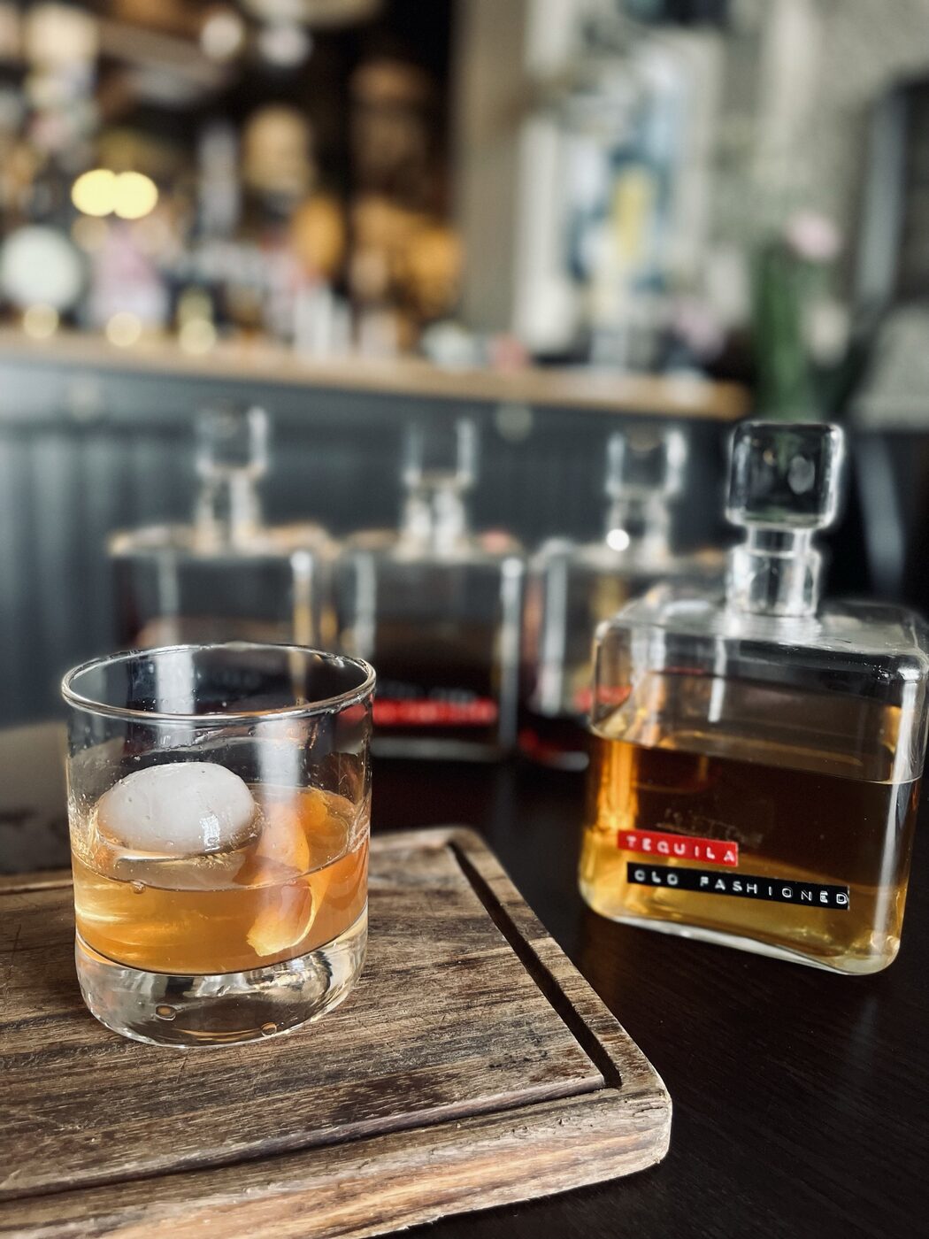 A proper grown-up cocktail at The Whippet Inn's bar — an Old Fashioned over a
single hand-cut ice ball, served on a wooden board